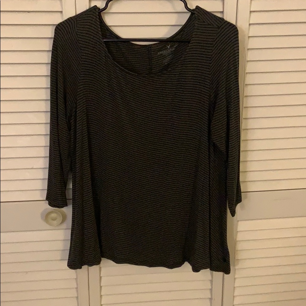 1/4 sleeve dark grey with back stripes.